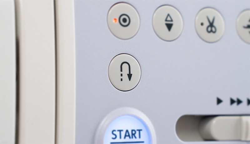 Janome Continental M6 Reverse button